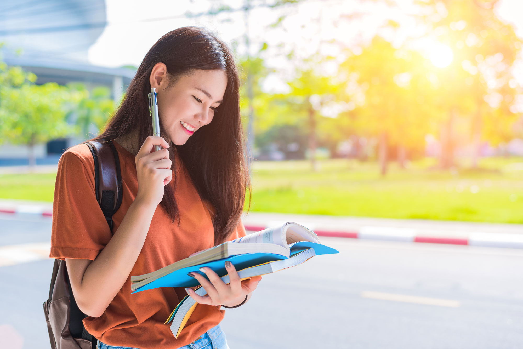 Pre-university student reading book in campus